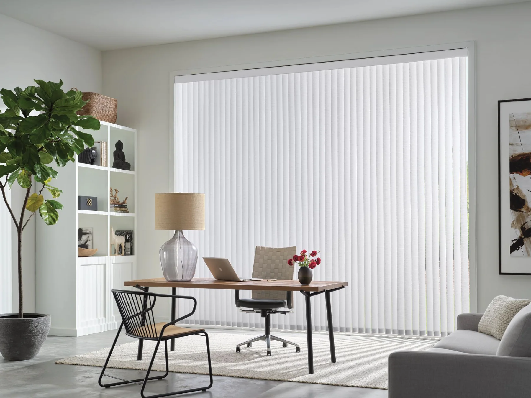 Bright modern room with full-height white vertical blinds